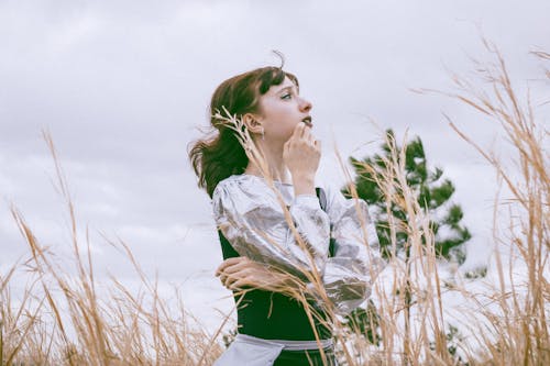 Young Woman Posing in Ears of Grain