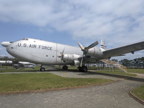 Large U.S. Air Force cargo plane displayed outdoors on a sunny day.