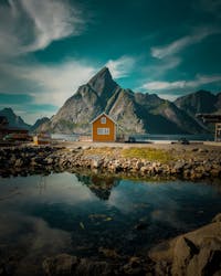 Brown Wooden House Near Mountain in Vågan, Norway