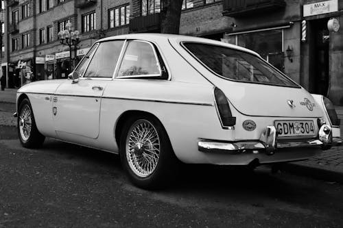 A Vintage MG MGB Parked on the Side of the Street 