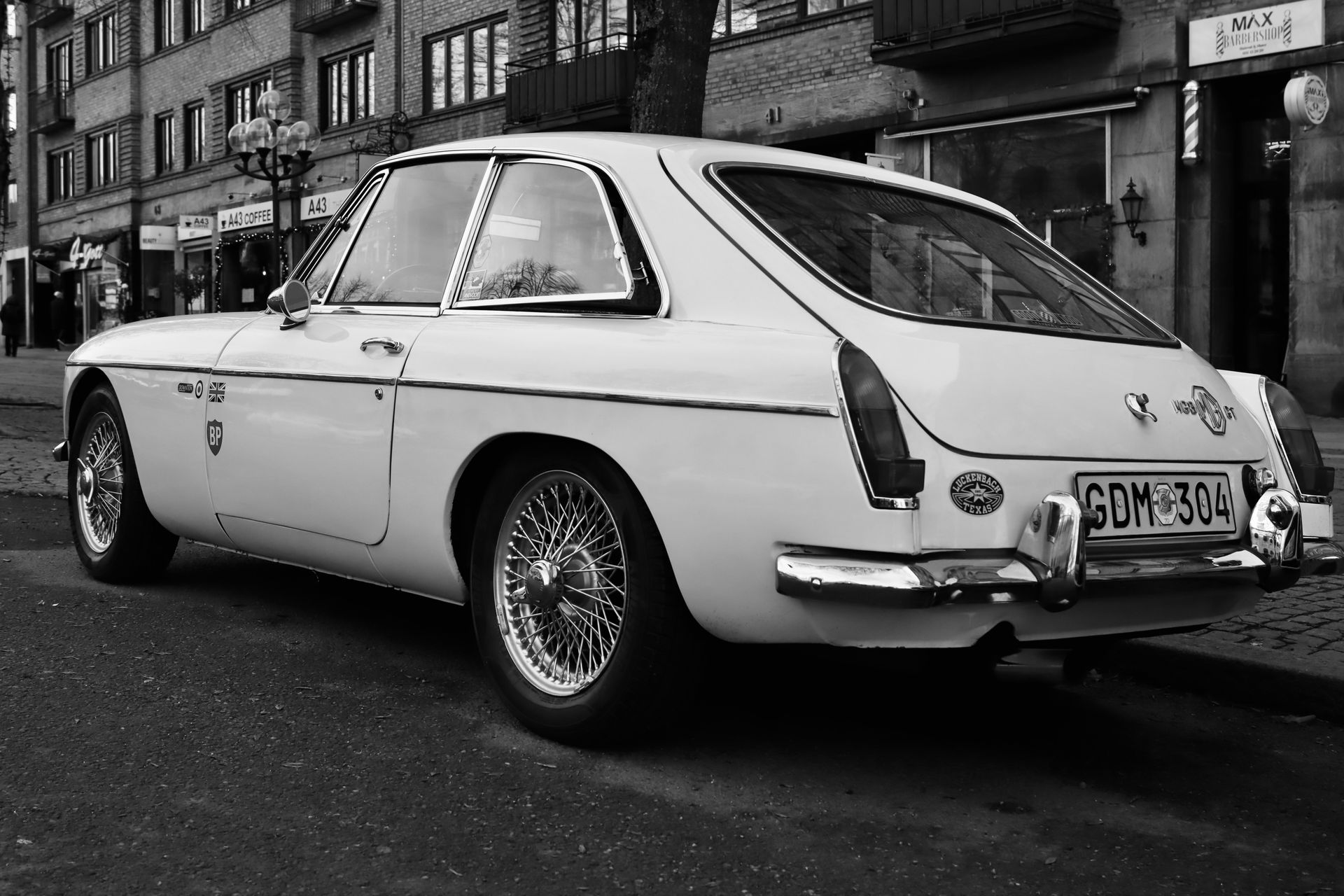 Classic MG MGB parked on a city street, showcasing its vintage British car charm.