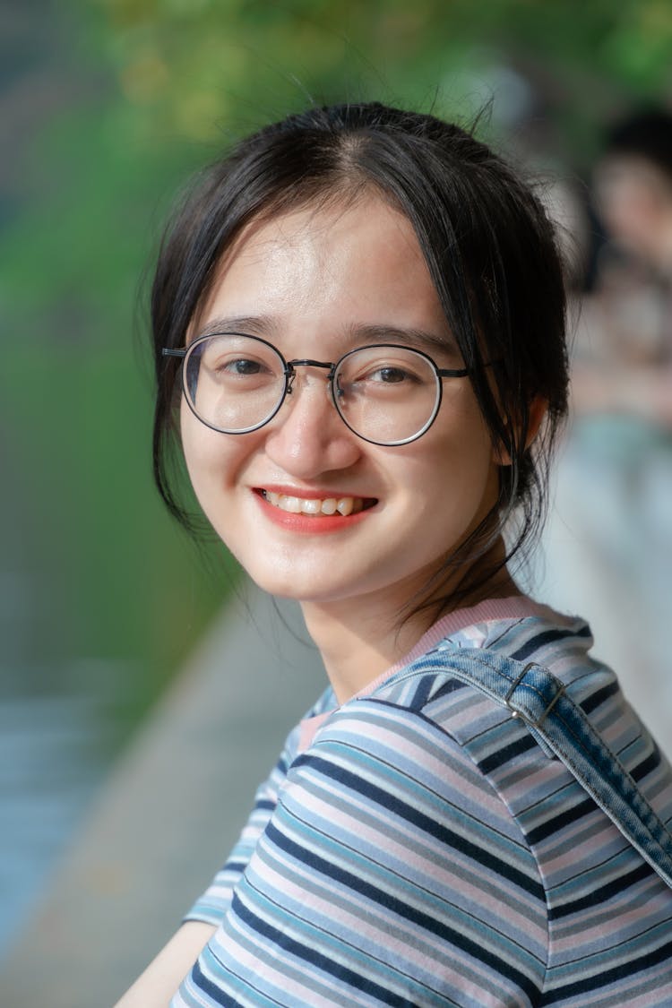 Portrait Of Smiling Girl In Glasses