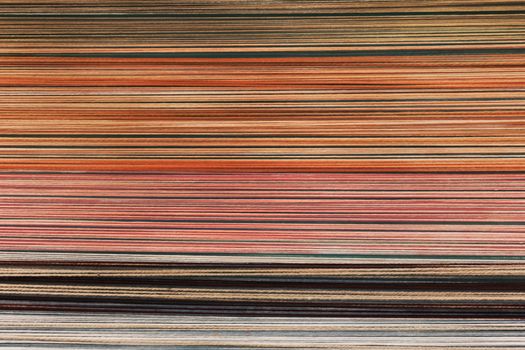 Detailed close-up of colorful striped fabric pattern showcasing vibrant textures and lines.