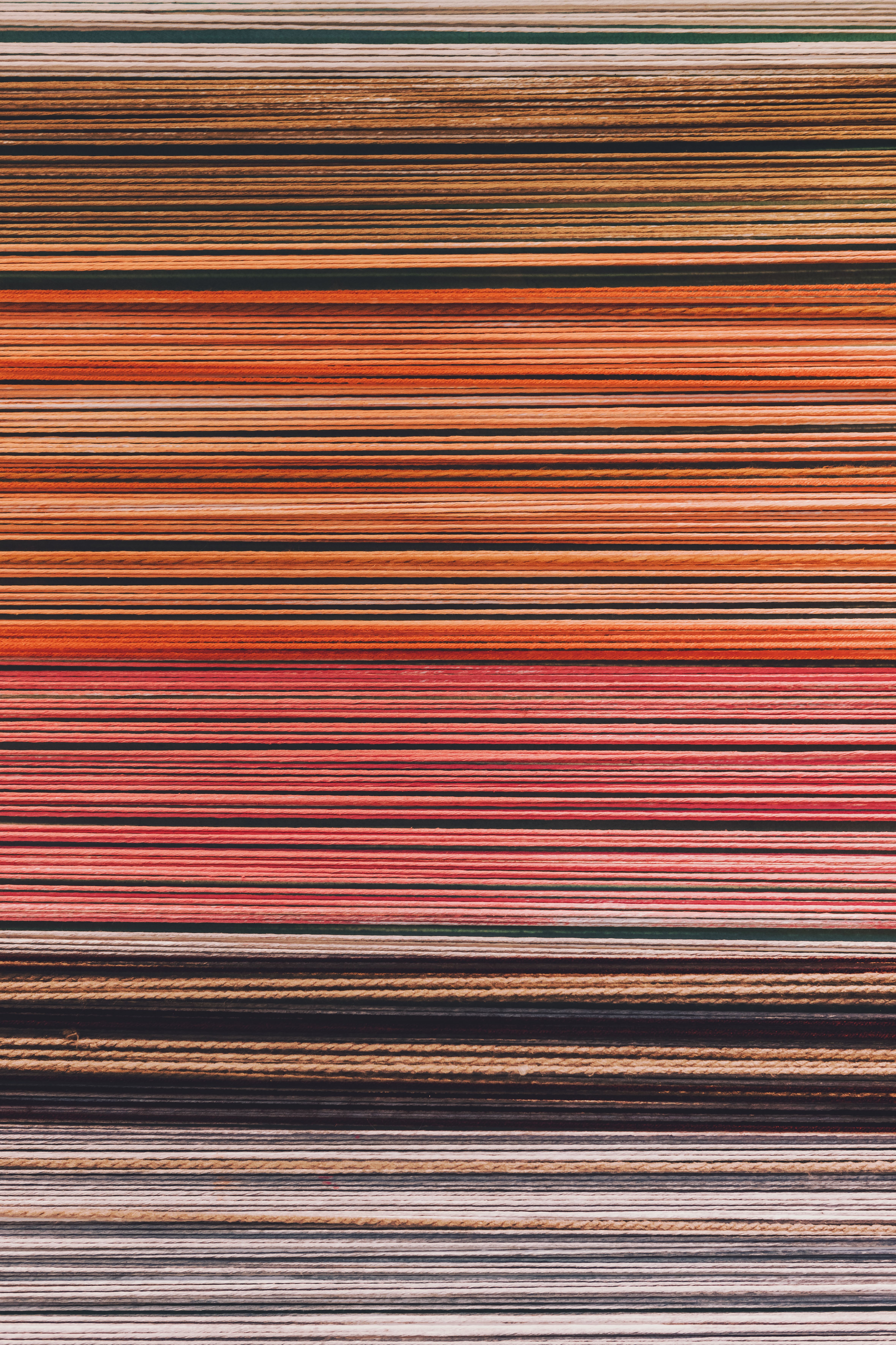 Abstract close-up of colorful vertical stripes in a layered pattern.