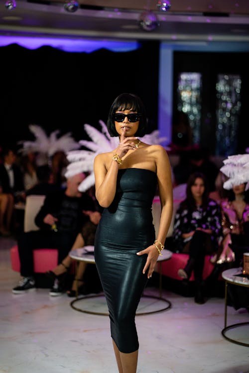 Young Woman in a Black Dress on a Fashion Show 