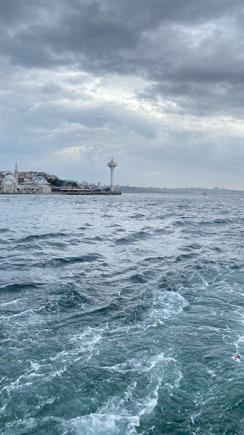 View of Waves on the Bosporus and Tower on the Shore in the Background in Istanbul, Turkey 