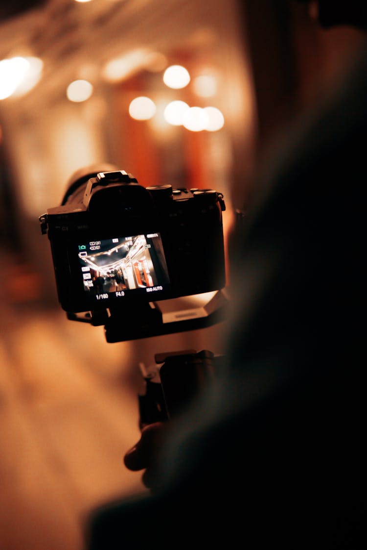 Person Using Camera At Night