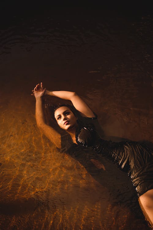 Woman in a Dress Posing in Water 