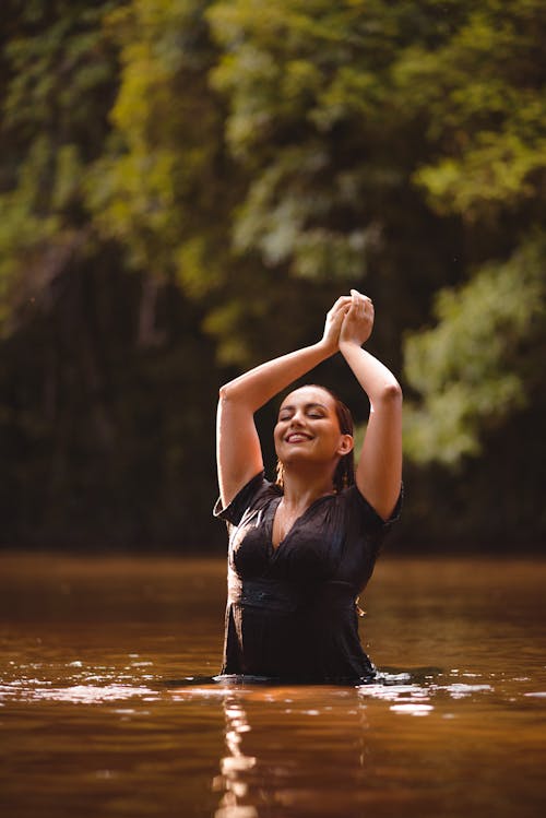 Woman in a Dress Posing in Water 