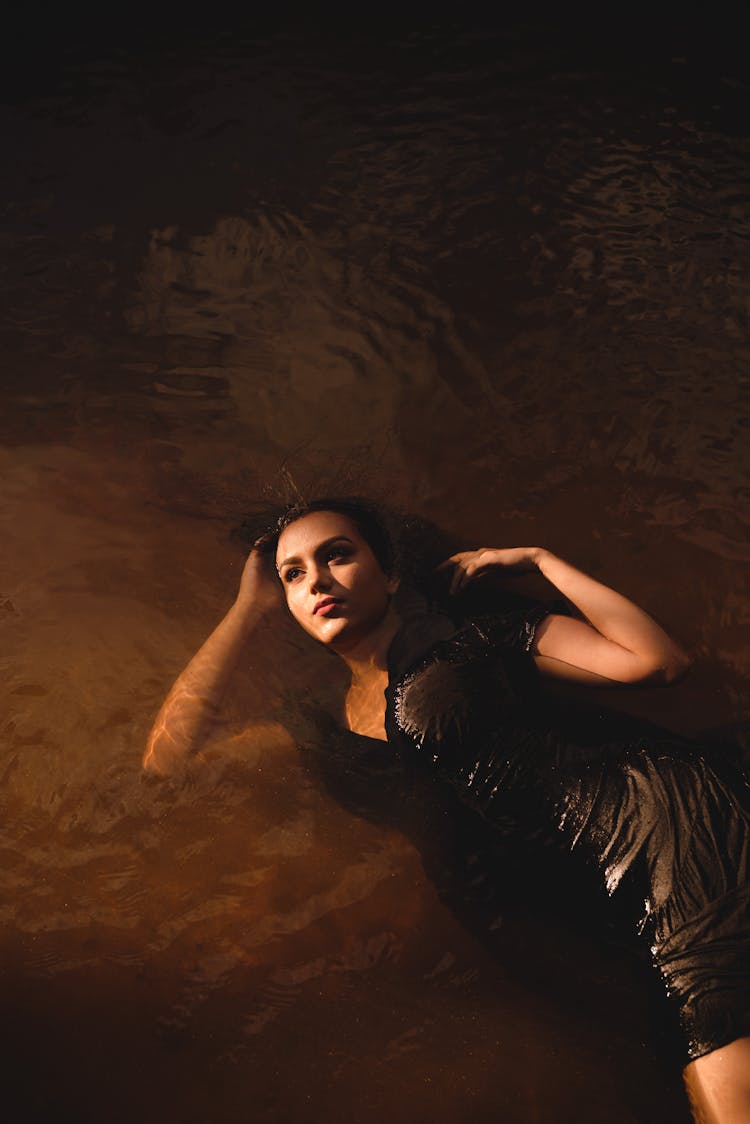 Woman In A Dress Posing In Water 