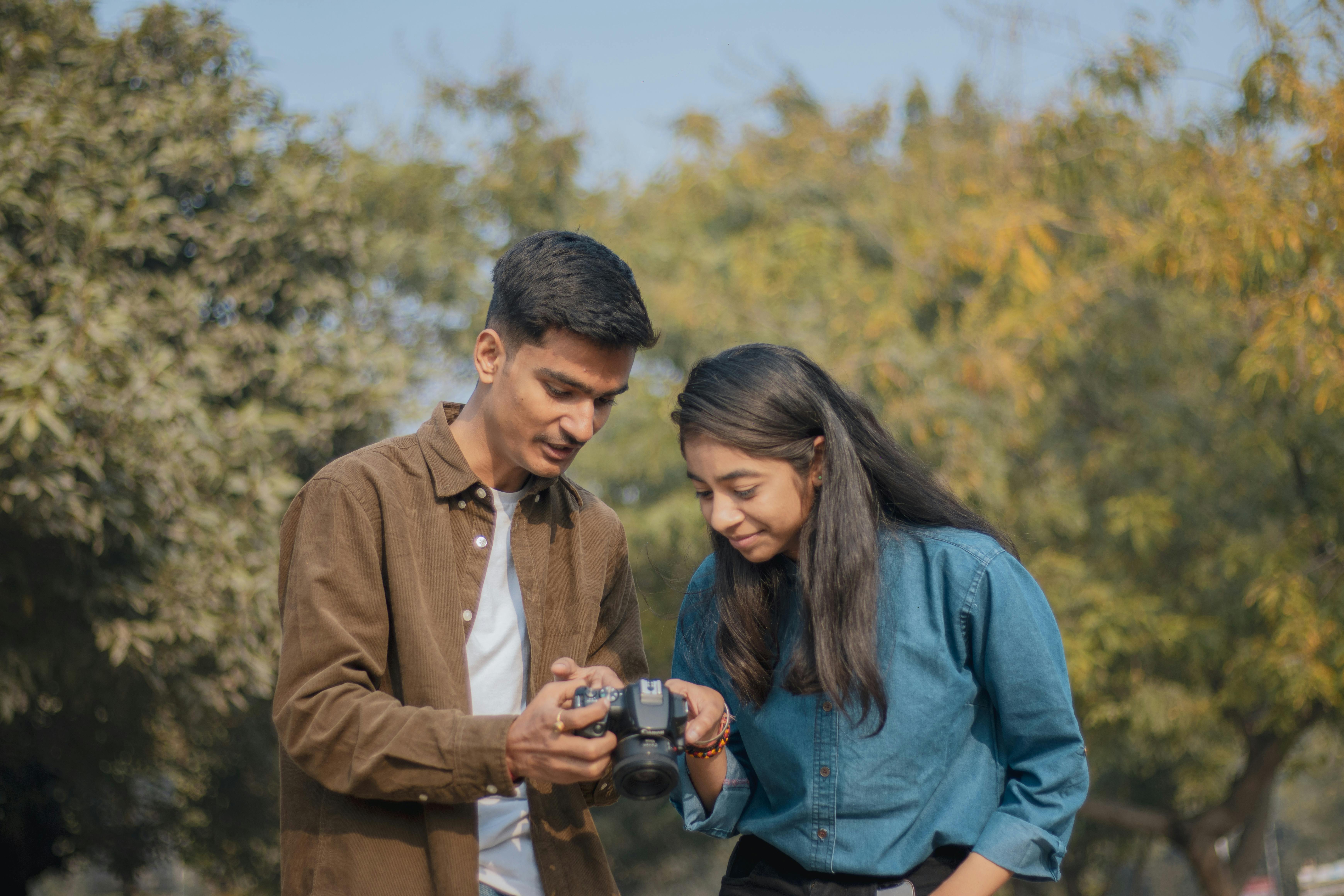 A diverse team of people examining geological maps.