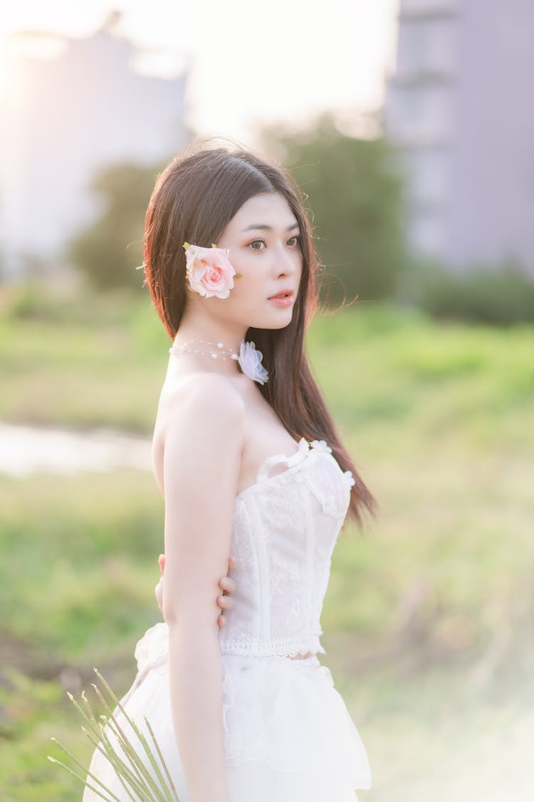 Bride In Wedding Dress With Flower In Hair