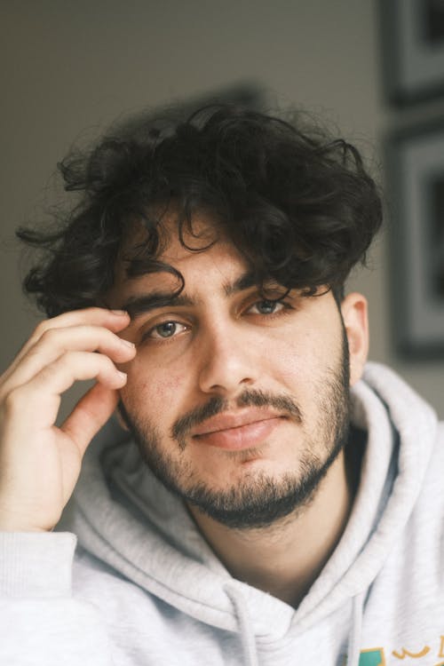 Portrait of a Young Man in a Gray Hoodie