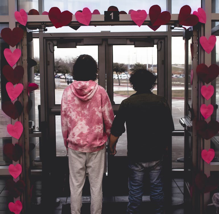 Couple Holding Hands in Doorway