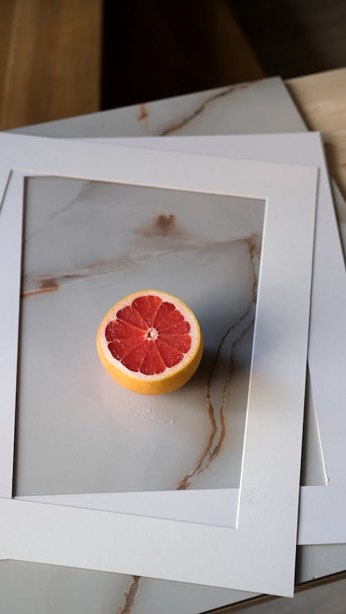 Still Life with Cut Grapefruit and White Mountings