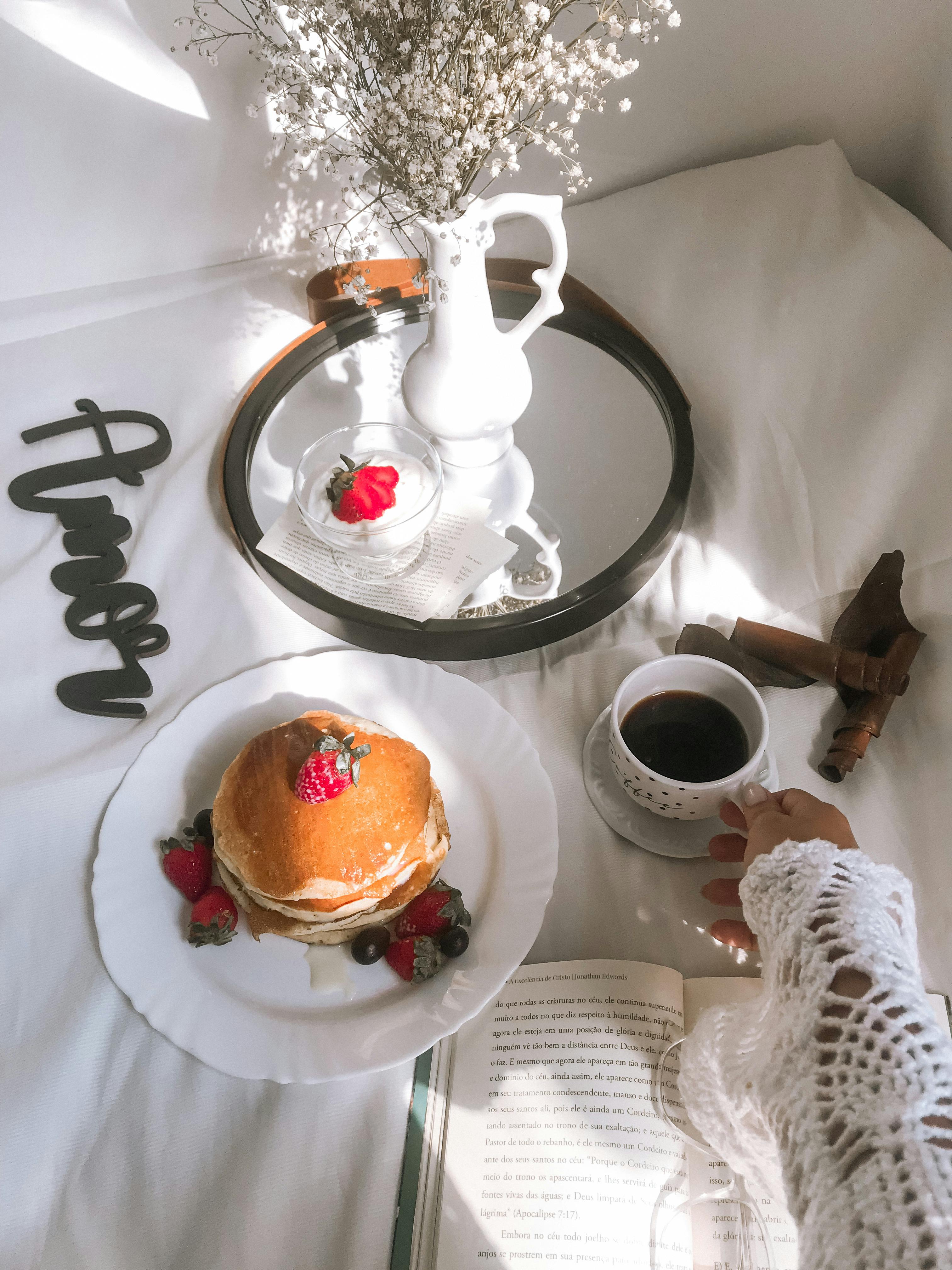 Woman Having a Cup of Coffee and Pancakes · Free Stock Photo