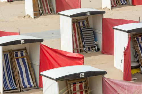 Free Colorful beach sheds and sunbeds on the sandy shores of Katwijk aan Zee, Netherlands. Stock Photo