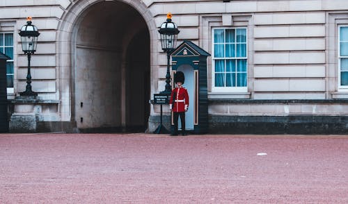 Free Royal Guard Standing Beside Building Stock Photo