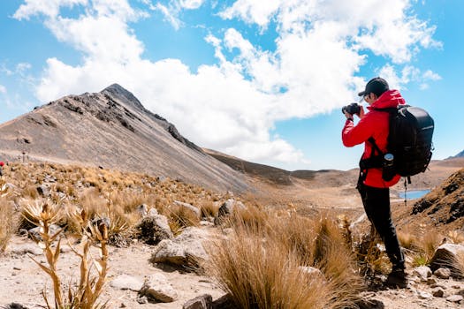 Hiker taking photos of Toluca de Lerdo, Mexico's stunning mountain scenery.