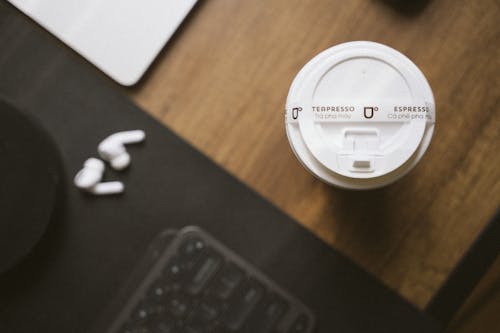 Disposable Coffee Cup on a Desk 