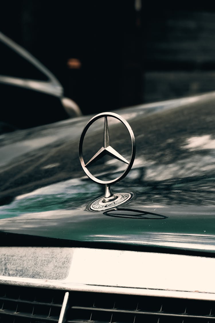 Close-up Of The Symbol On A Mercedes Hood