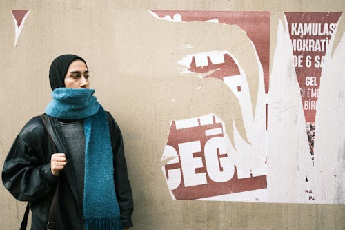 Fashionable Young Woman in a Jacket and Blue Scarf 