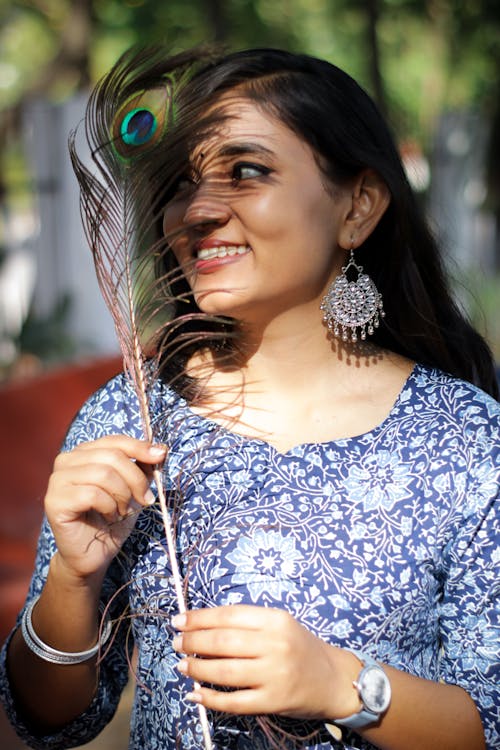 Portrait of Indian Woman Holding a Feather 