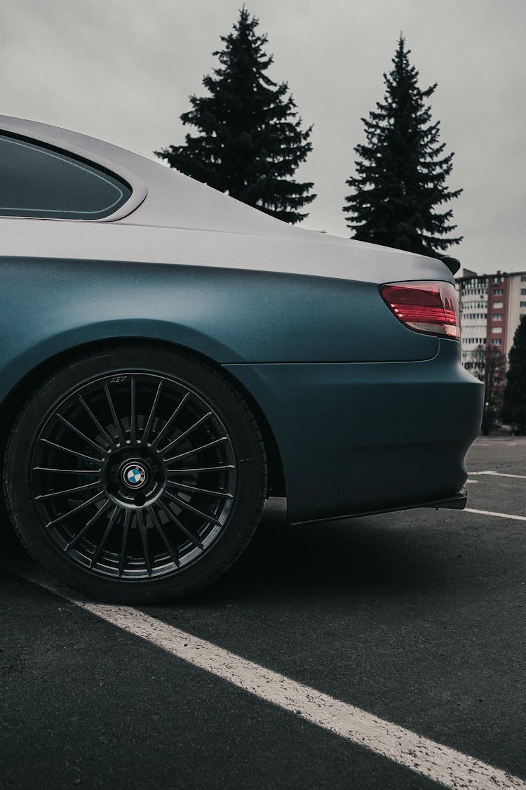 White And Blue BMW On A Street 