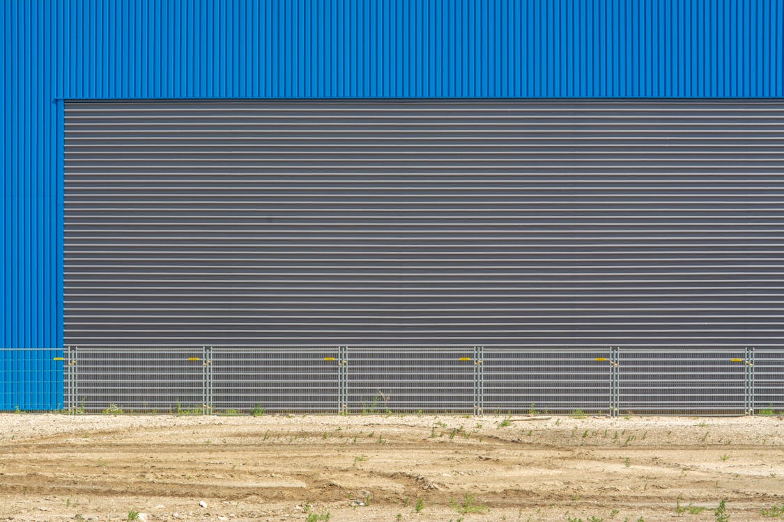 Corrugated Metal Facade and a Fence