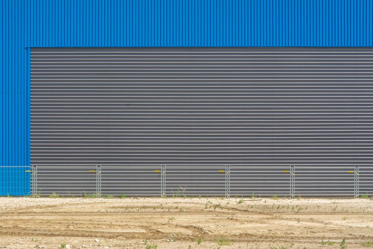 Corrugated Metal Facade And A Fence