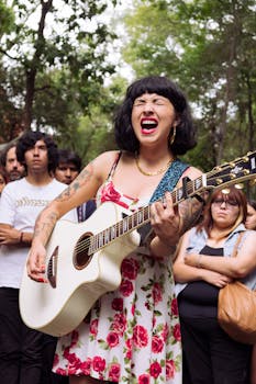 A vibrant street musician passionately plays guitar in Ciudad de México, surrounded by a captivated audience.