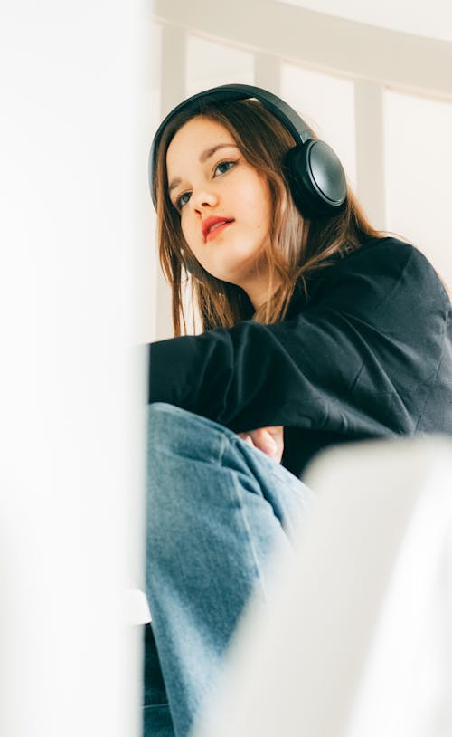 Free Girl Sitting in Headphones Stock Photo