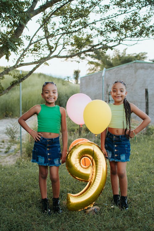 Free Smiling Girls with Birthday Balloons Stock Photo