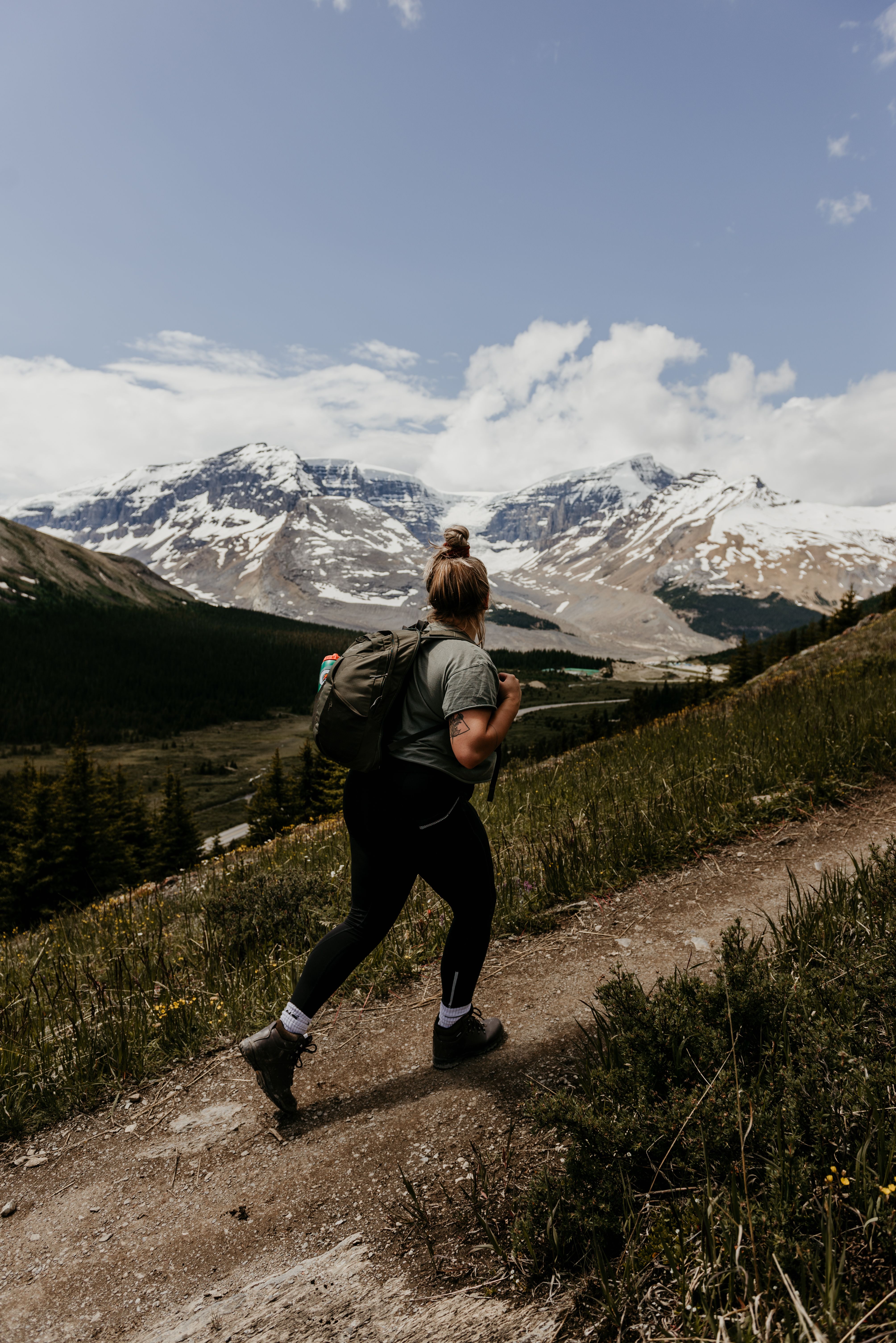 Woman Hiking in Mountains · Free Stock Photo