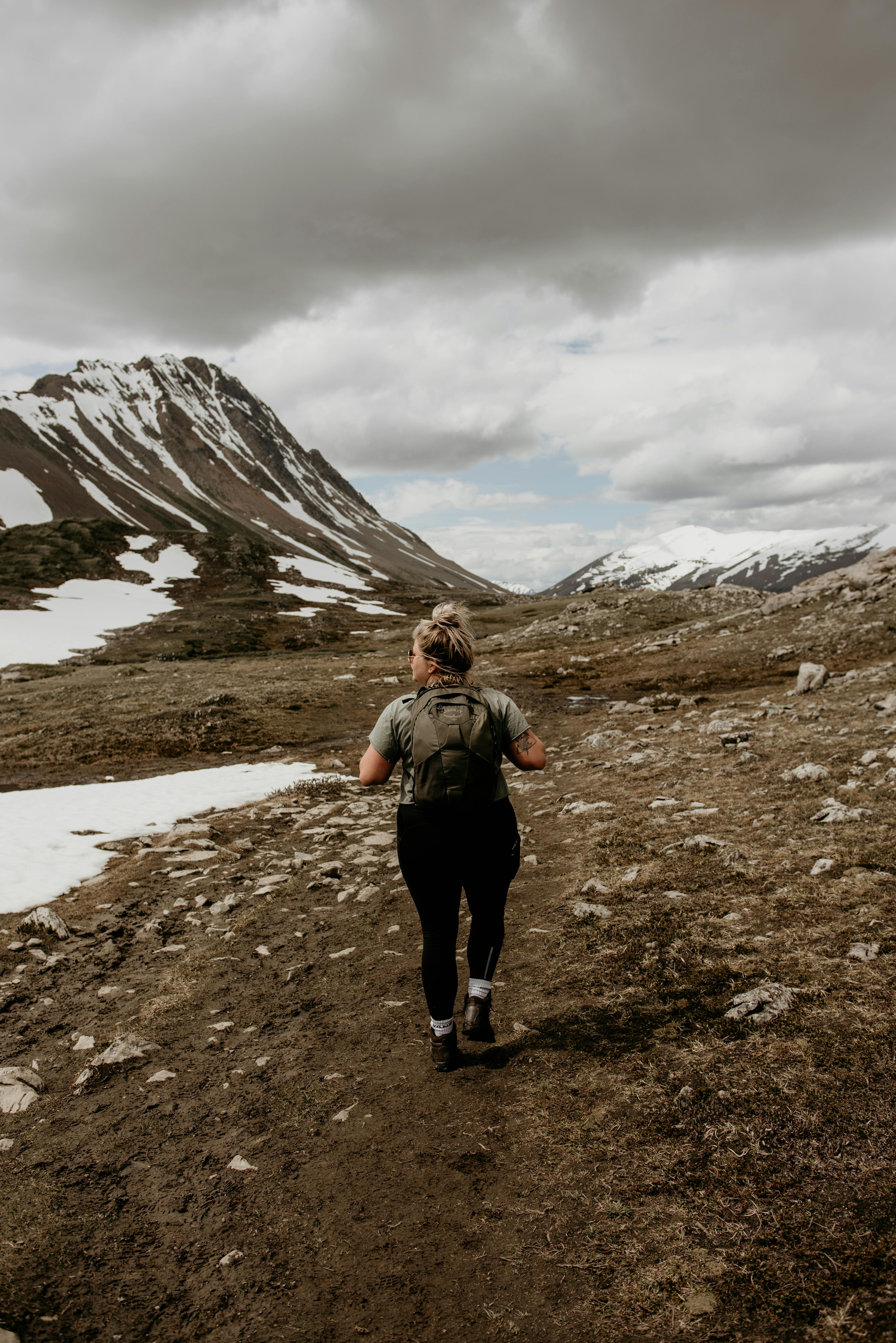 Woman Hiking in the Mountains · Free Stock Photo