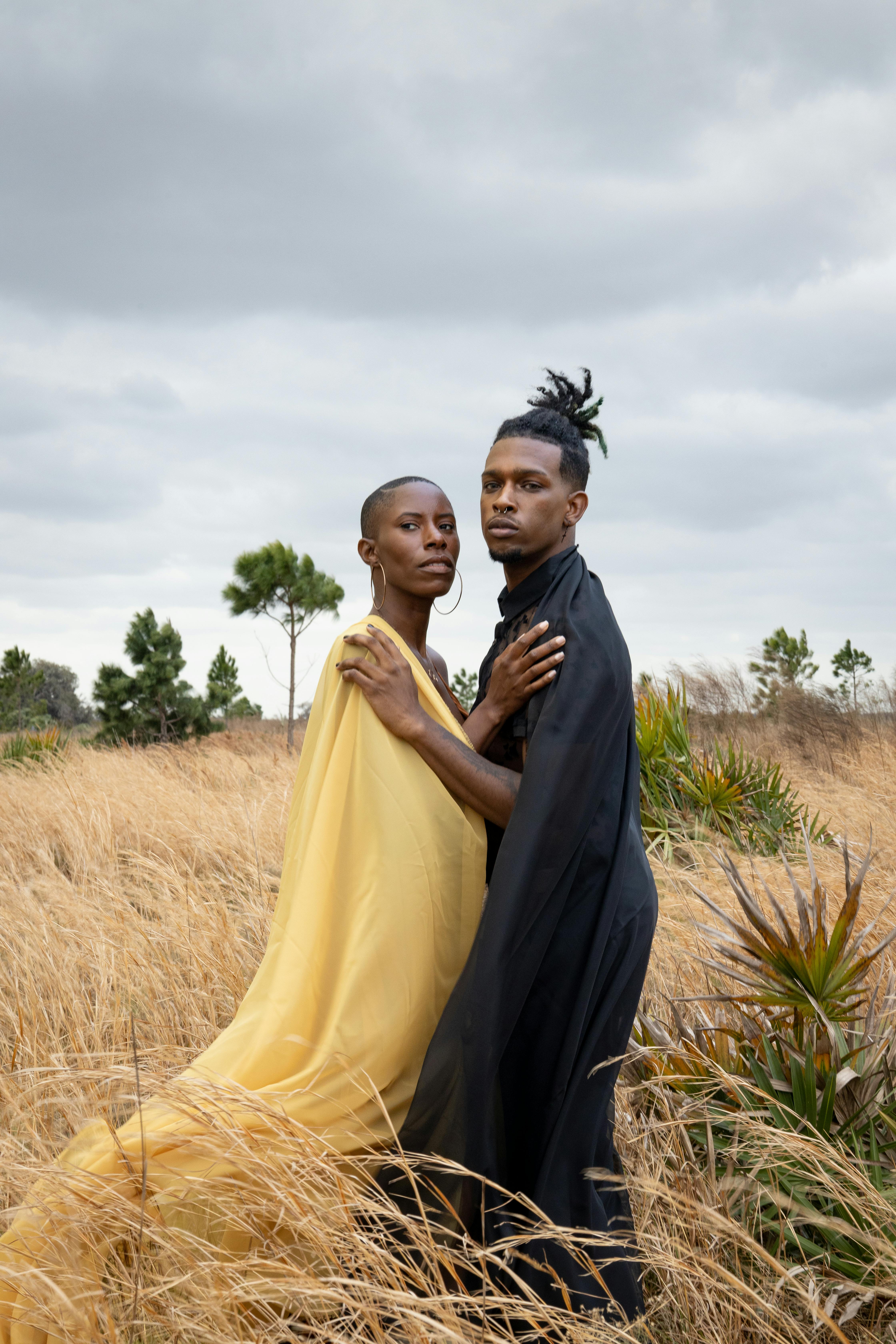 two african american people in a field