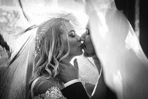 Newlyweds Kissing in Black and White
