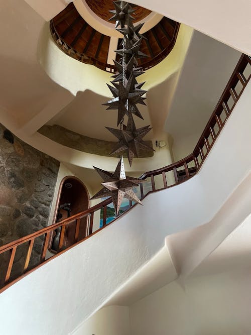 Free Decoration Stars Hanging in Middle of Staircase Stock Photo