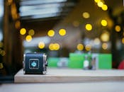 Selective Focus Photography of Black Case on Brown Wooden Surface