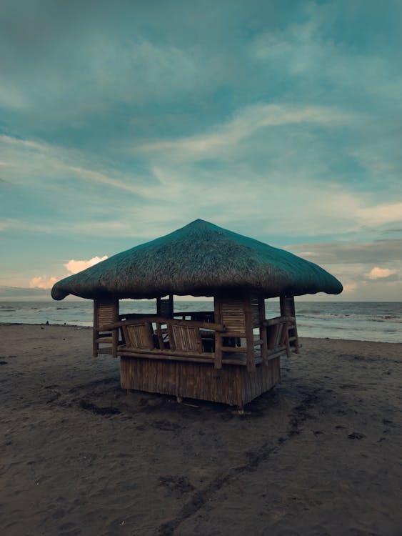 Wooden Hut on a Beach at Dusk 