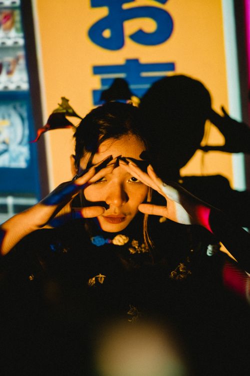 Free Creative portrait of a woman posing with intriguing projector shadows in Malang, Indonesia. Stock Photo