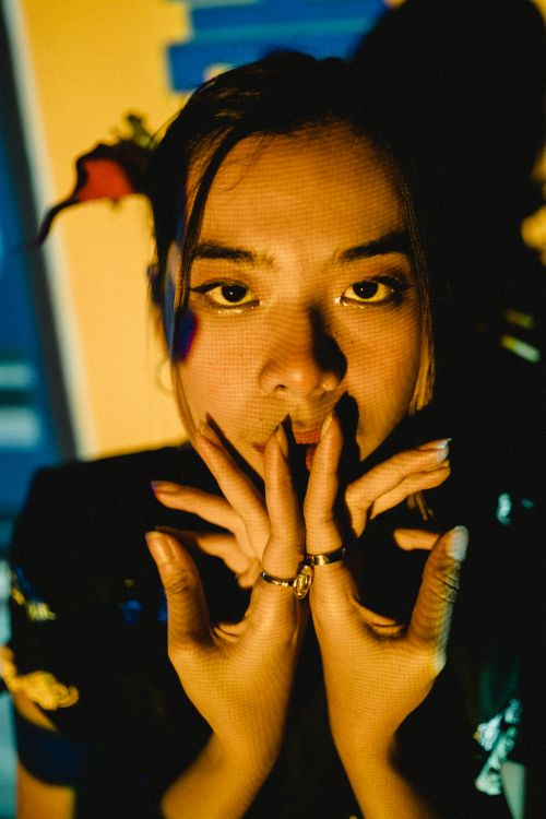 Free Captivating portrait of a woman with rings, dramatic lighting, and a shadow play. Stock Photo