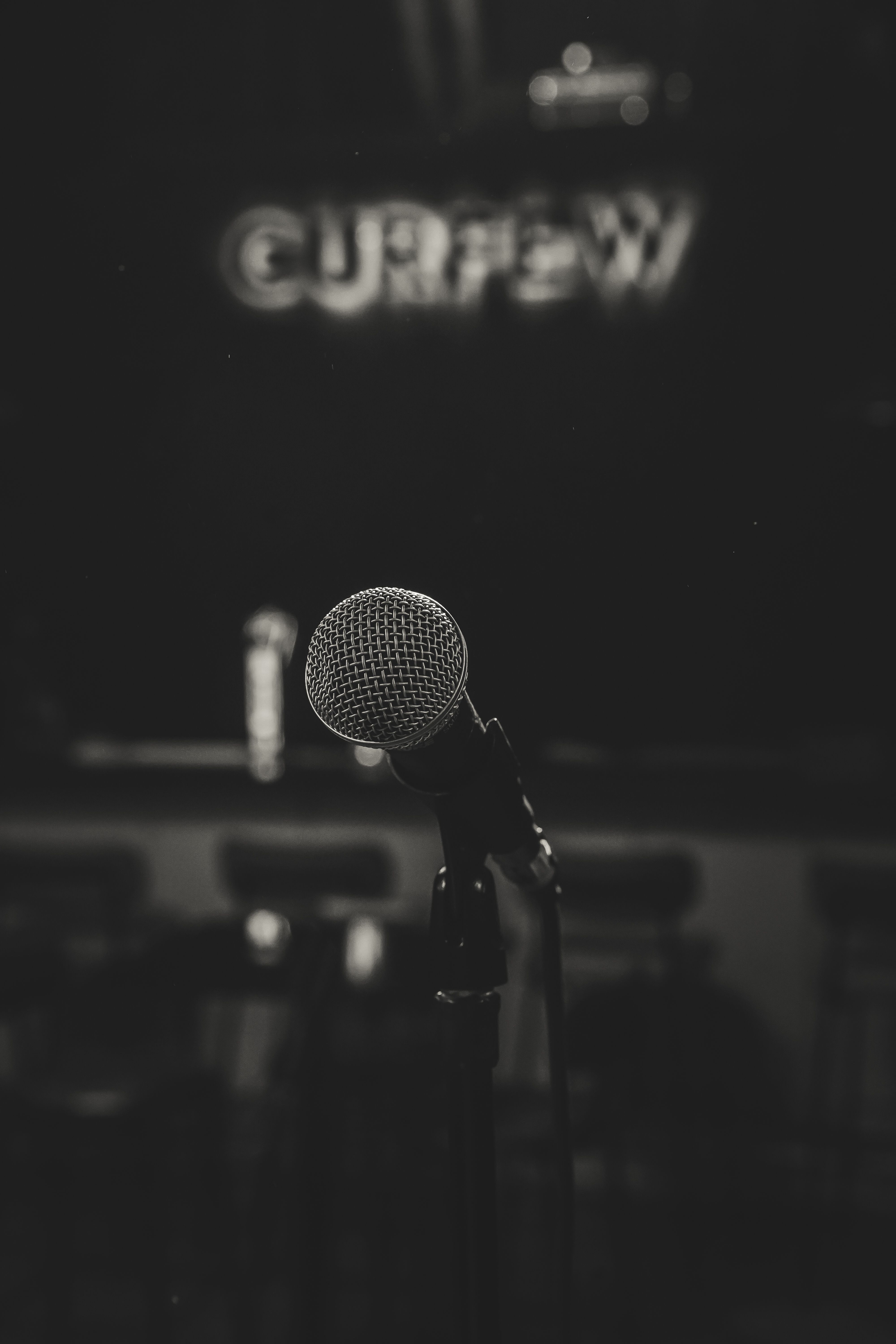 Close-up of a microphone on a stage in Jakarta, creating a moody, atmospheric vibe.