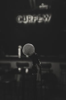 Close-up of a microphone on a stage in Jakarta, creating a moody, atmospheric vibe.
