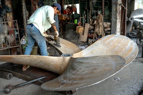 Man Working on a Ship Propeller