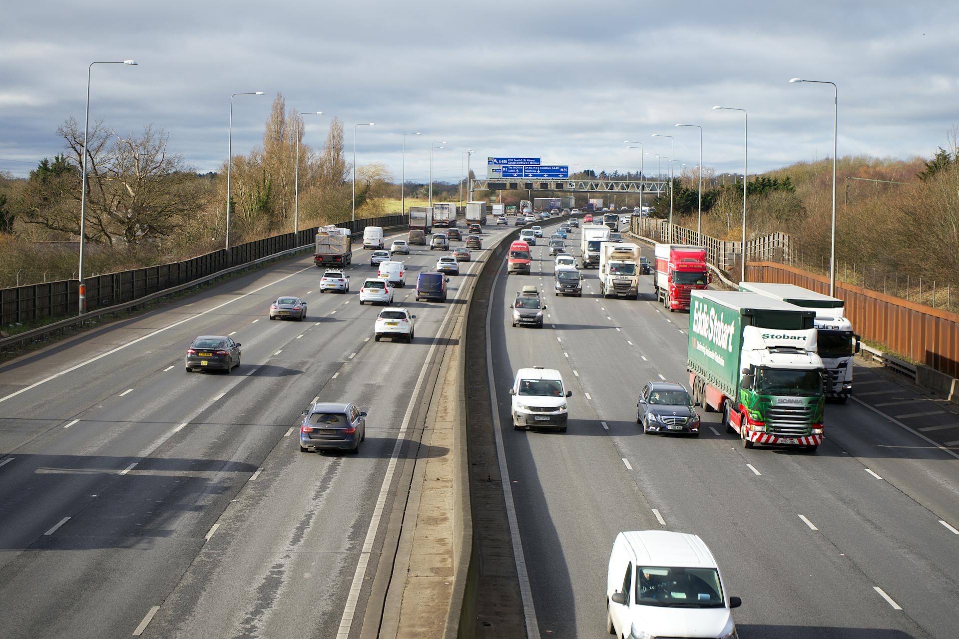 A dynamic view of cars and trucks on a busy motorway in St Albans, England.