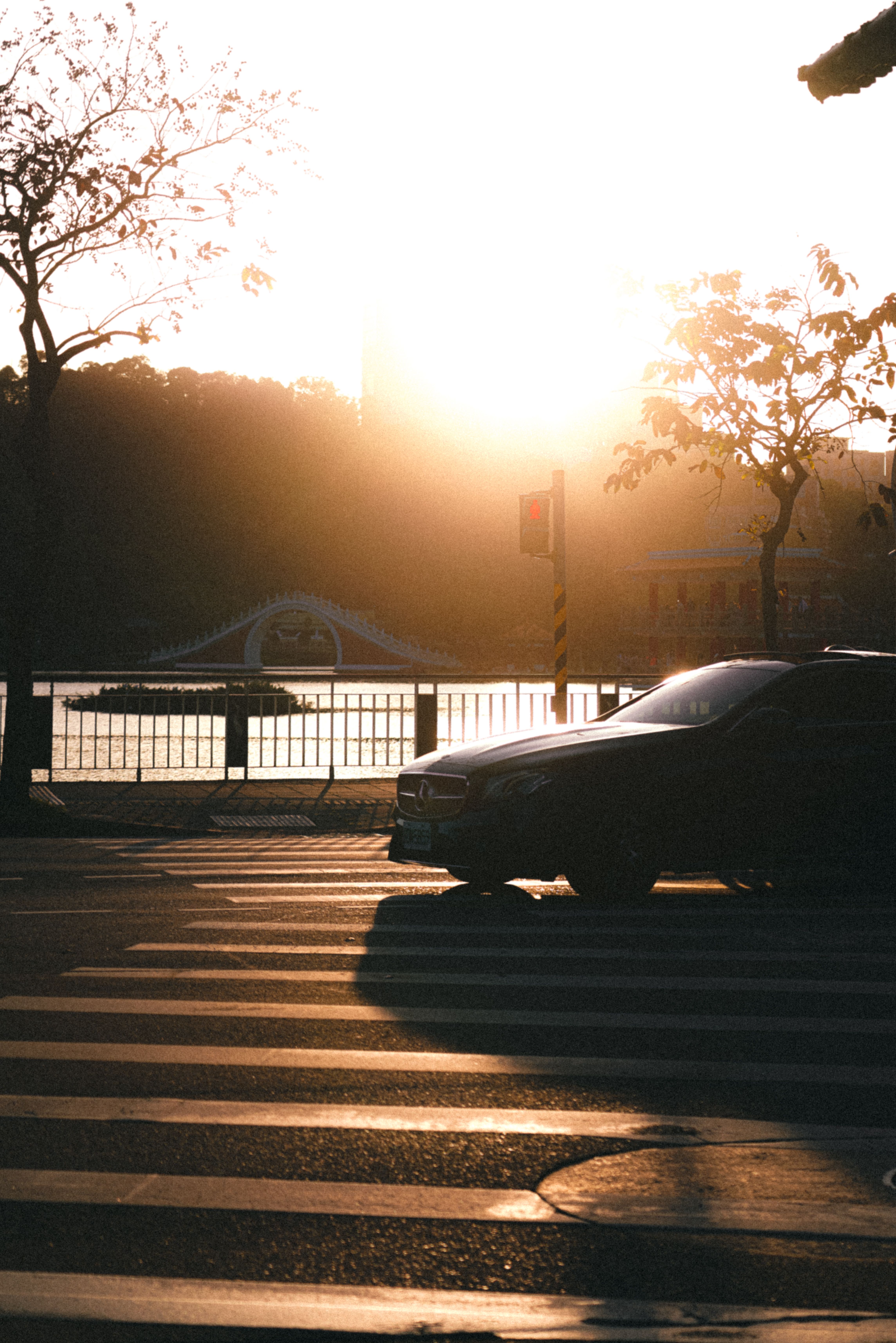 View of a Car on a Street in City at Sunset · Free Stock Photo