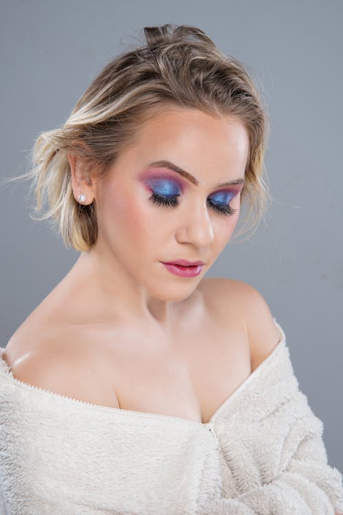 A woman with blue and purple makeup
