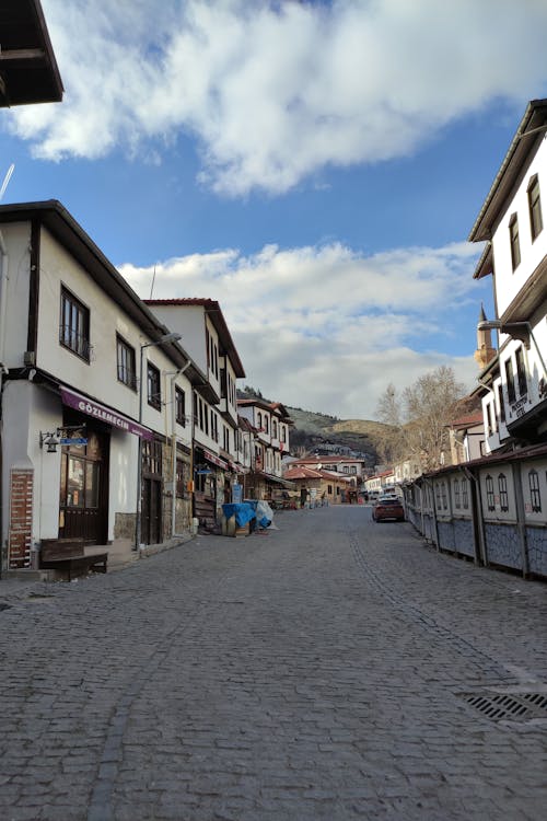A Cobblestone Street between Traditional Houses 