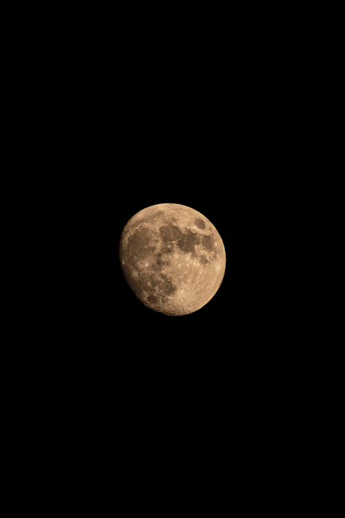 Free Capture of the majestic full moon set against a dark night sky, exuding serenity and calm. Stock Photo
